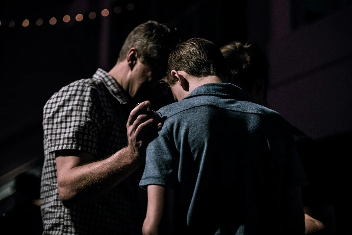 men's praying to each other's 
